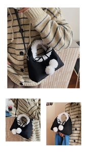 Detail of a black velvet bucket bag featuring white faux fur trim and fluffy pom-poms