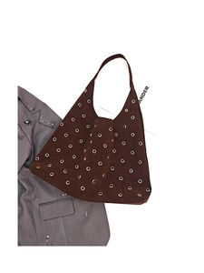 Detailed overhead view of large brown suede hobo bag featuring gold metal eyelet accents