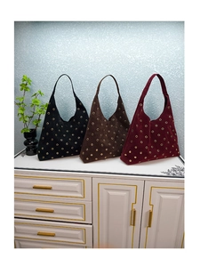 Detailed comparison of three suede shoulder bags with gold rivets in black, brown and burgundy