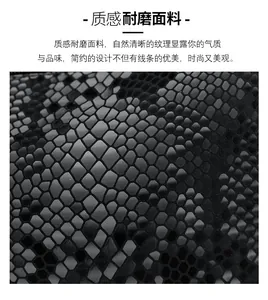 Close-up of black faux snakeskin texture with durable scale pattern on fashion handbag