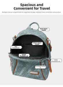 Detail view showing internal compartments and multiple pockets of blue denim backpack