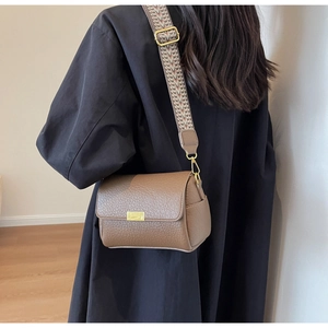 Brown litchi leather crossbody bag with vintage geometric pattern wide shoulder strap