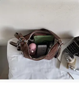 Detailed view of the large capacity interior of this brown leopard print crossbody bag