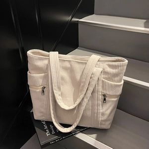 White corduroy large capacity tote bag for women showing durable texture and side zip pockets