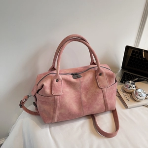 Pink vintage faux leather Boston tote bag with top handles and adjustable strap for women