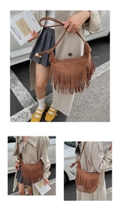 Detail of brown faux suede hobo bag with fringe tassels and wooden bead strap accents