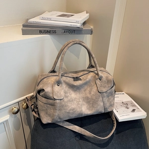 Vintage gray Boston handbag with distressed texture and adjustable shoulder strap