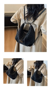 Detail showing the dark leopard print texture and metal logo plaque on a black hobo bag
