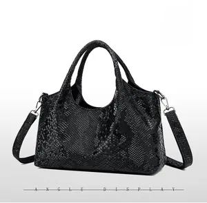 Side view of black snake embossed leather handbag with silver hardware and dual handles