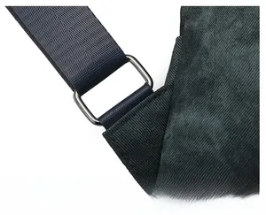 Close-up of reinforced shoulder strap connections with durable metal buckles on backpack