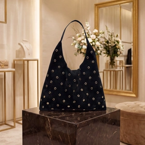 Large black suede hobo shoulder bag with stylish gold metal eyelet rivet accents