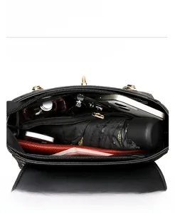 Top view of the spacious black leather bag interior showing compartments and storage