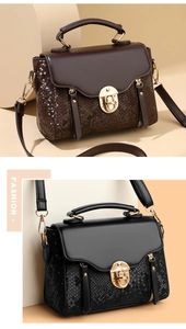 Detail view of vintage crossbody bag with snakeskin texture and metal twist lock hardware