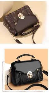 Detail of vintage crossbody bags with snakeskin texture panels and gold metal clasp