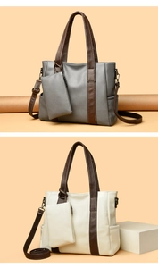 Detail view of large tote bags with lychee grain texture and removable small pouches