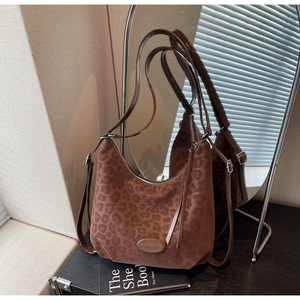 Detail of leopard print hobo bag with adjustable strap and smooth faux suede texture