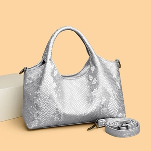 Silver snakeskin tote bag with metallic texture, stylish top handle and long shoulder strap