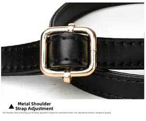 Detailed macro shot of adjustable golden metal buckle on black leather shoulder strap