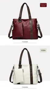 Detail view of large faux leather tote bags in burgundy and white with contrast straps