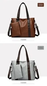 Detail of vintage tote bag set with detachable pouch and adjustable straps in tan and blue