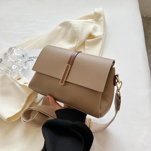 Khaki pebbled leather crossbody bag with wide canvas strap and gold buckle detail