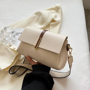 Chic beige lychee leather crossbody bag with wide strap and gold hardware accents