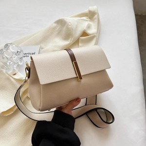 Chic beige crossbody square bag with wide strap and gold hardware detail