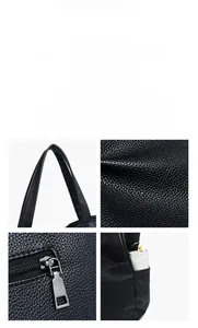 Close-up of black pebble leather tote featuring durable metal zippers and a side umbrella pocket