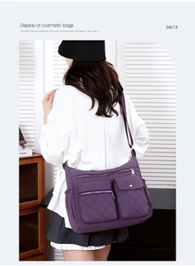 Detail of purple nylon crossbody bag featuring diamond quilted texture and multi-pockets