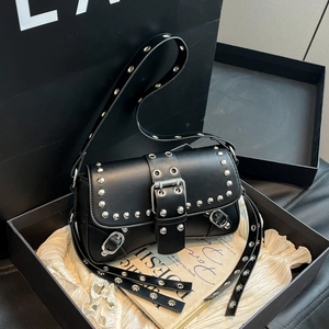 Punk black shoulder bag with silver studs and belt buckle in a premium gift box setup