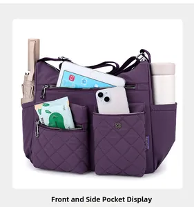 Detail of large capacity purple nylon crossbody bag showing multiple pockets and quilted storage