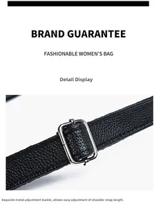Detail of adjustable black pebble grain leather strap with silver rectangular metal buckle