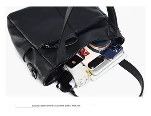 Detail of large black litchi pattern tote bag showing spacious interior with daily essentials