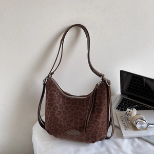 Leopard print crossbody shoulder bag with vintage faux suede finish and brown straps
