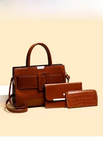 Detailed set of brown leather tote bag, envelope clutch and embossed zipper wallet
