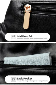 Détails de la fermeture dorée et poche antivol sur sac à main en cuir grainé noir