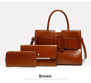 Three-piece brown tote bag set with large handbag, envelope pouch and crocodile pattern wallet