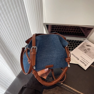 Vintage denim blue pleated cloud handbag with brown leather handles and silver hardware