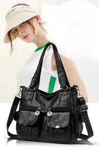 Close-up of black retro soft leather tote bag with multi-pocket functional details