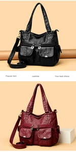 Detail view of premium cowhide leather handbags in black and wine red with zip pockets