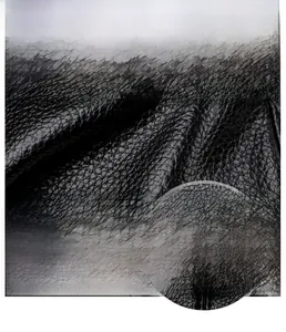 Close-up of black lychee grain faux leather texture with silver metal ring hardware