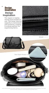 Detail of the black pebbled leather crossbody bag showing inner compartments and silver buckle