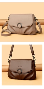 Detail of lychee pattern leather bags with double ring metal buckles and flap closure