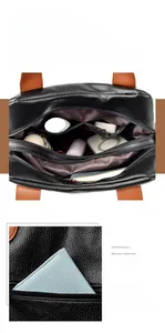 Détail du grand compartiment intérieur et de la poche arrière zippée du sac à main