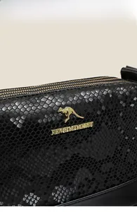 Close-up of black snake texture leather with golden kangaroo logo and zip closure