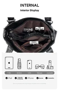 Detailed view of the black leather bag's inner pockets and brown fabric lining storage