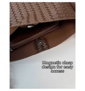 Detail view of woven bucket bag with magnetic closure and large interior capacity