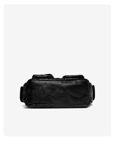 Detail view of the soft black leather bottom and vintage wash texture of the tote bag