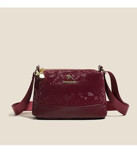 Detail of burgundy snakeskin texture Boston bag with golden kangaroo logo and strap