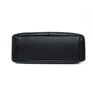 Large capacity black soft leather tote bag showing high-quality lychee texture and stitching